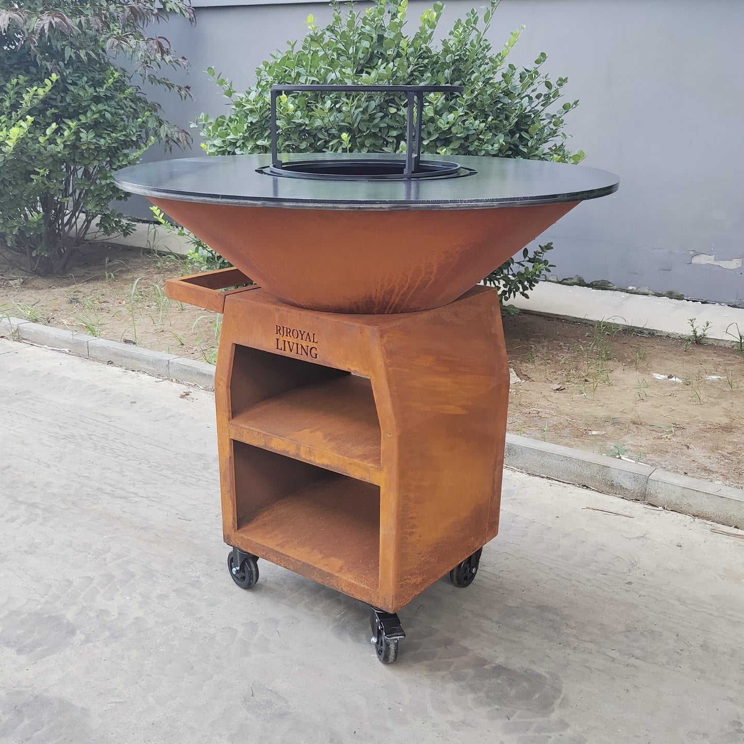 BBQ Plancha Grill Maestro XXXL Ø100cm Acciaio Corten - Con ruote grandi e contenitore per la legna