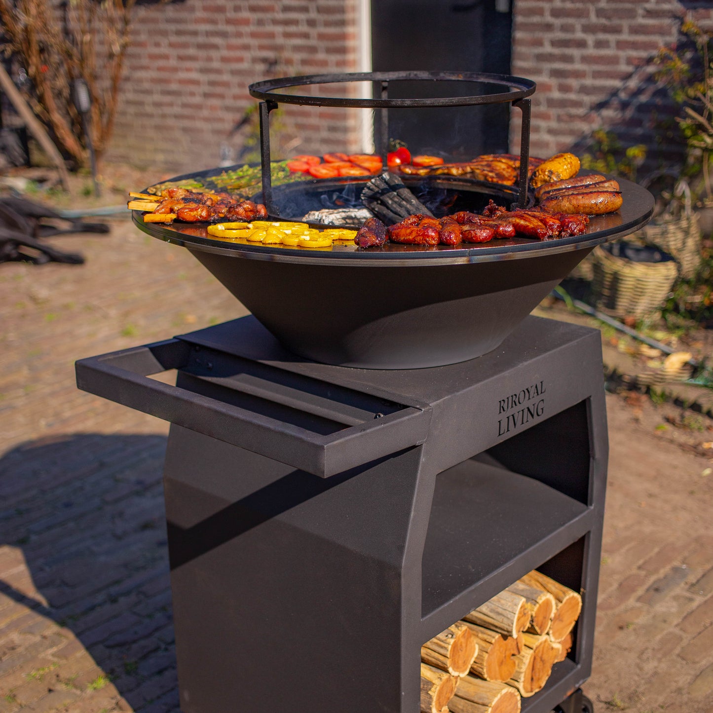 Griglia Plancha BBQ Maestro Ø70 cm Blackline - Con ruote grandi e vano porta legna