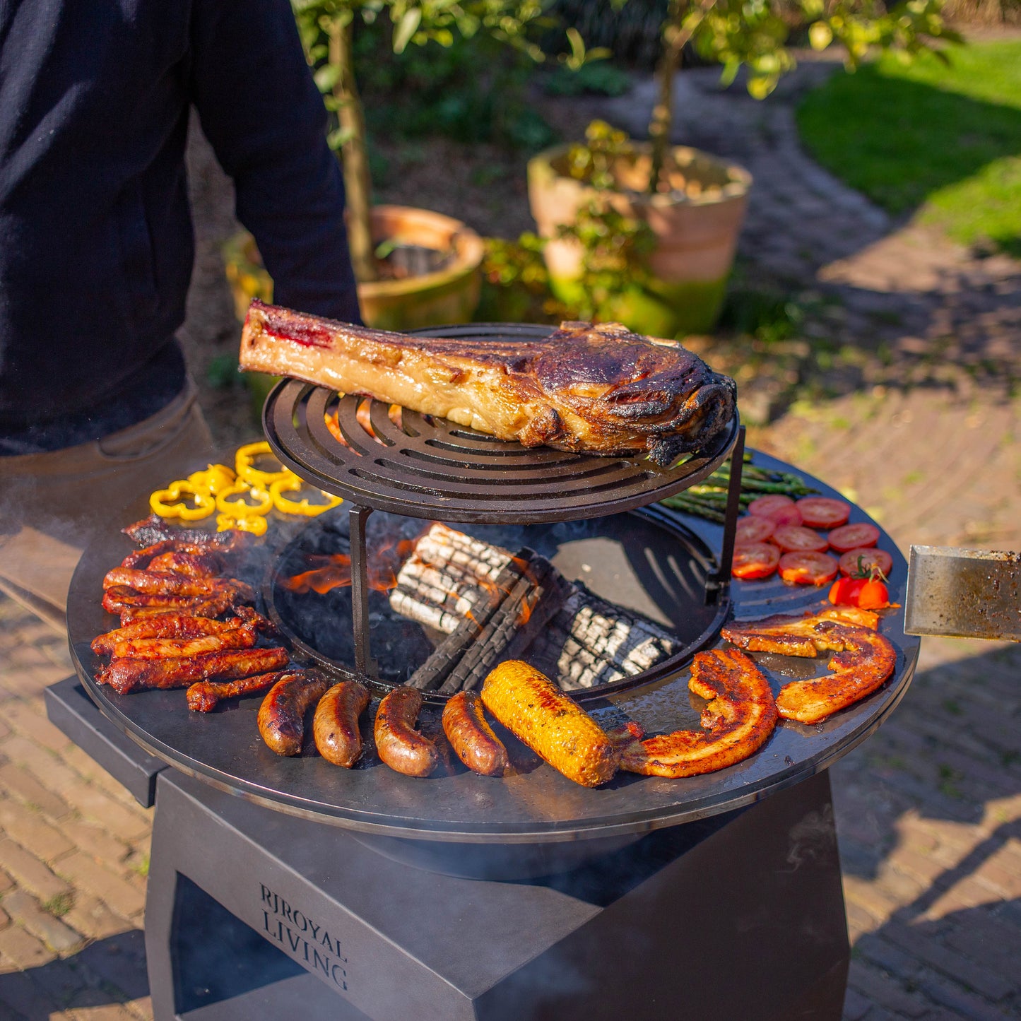 Griglia Plancha BBQ Maestro Ø70 cm Blackline - Con ruote grandi e vano porta legna