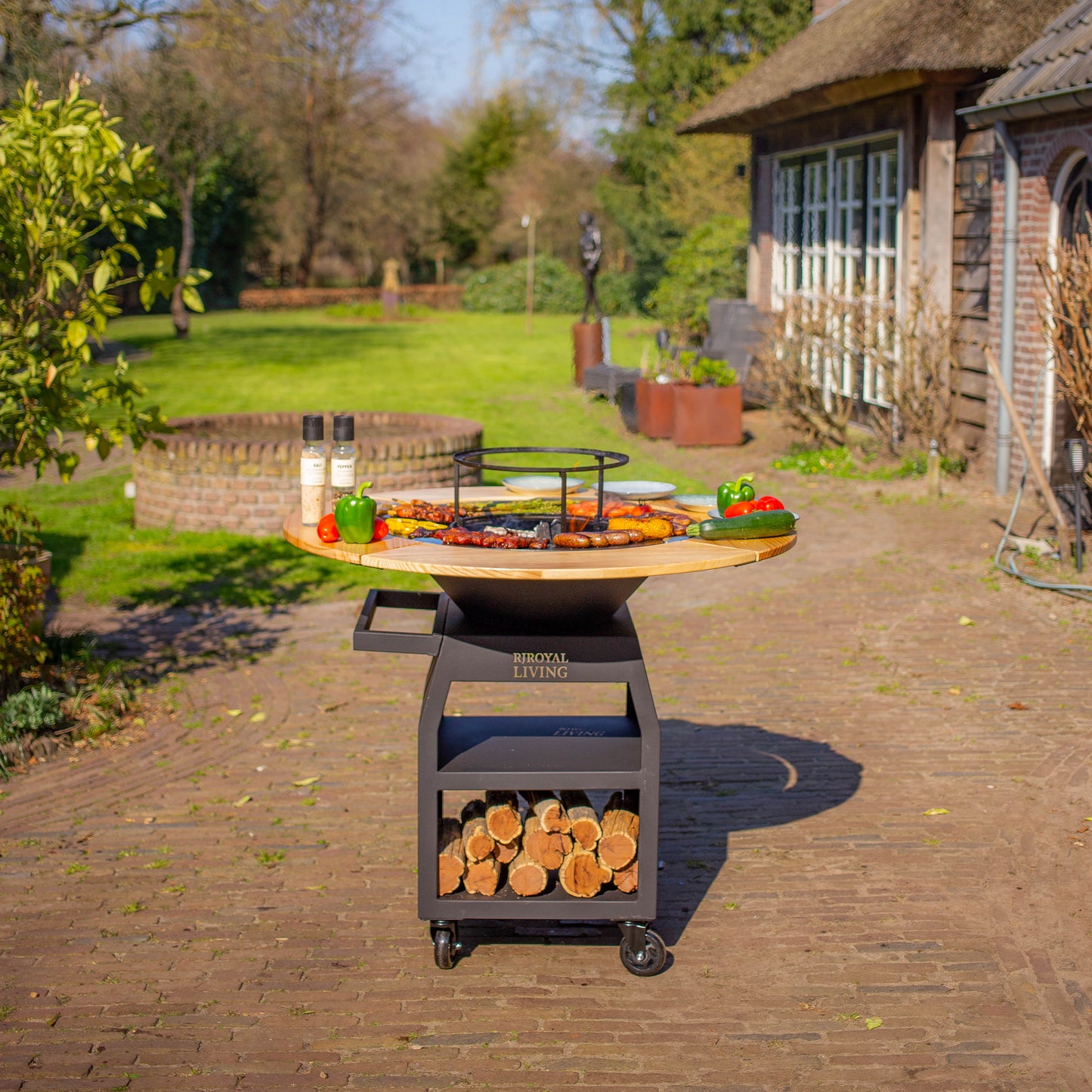 BBQ Plancha Grill Maestro XXXL Ø70cm Acciaio verniciato a polvere nero - Con ruote grandi e contenitore per la legna