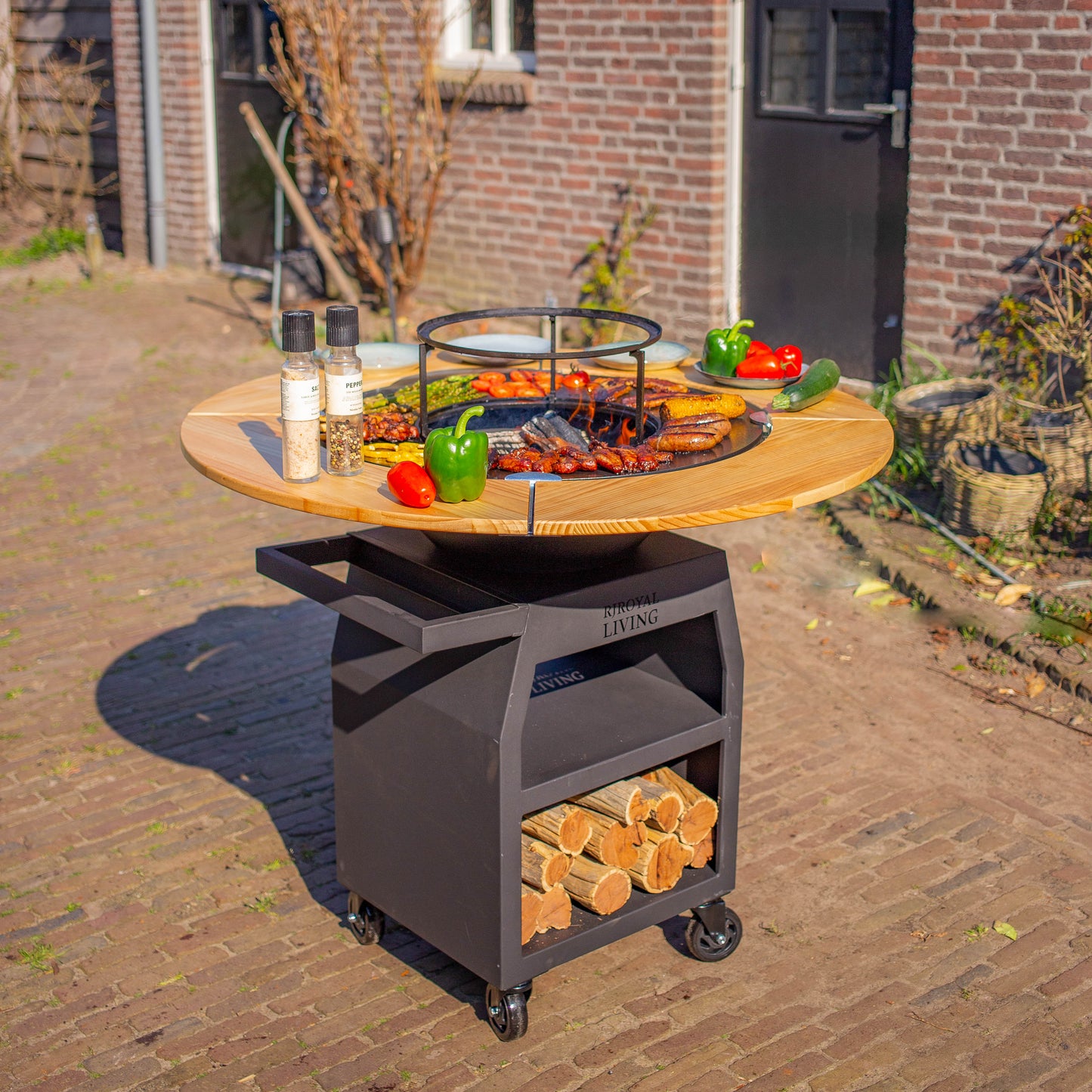 BBQ Plancha Grill Maestro XXXL Ø70cm Acciaio verniciato a polvere nero - Con ruote grandi e contenitore per la legna