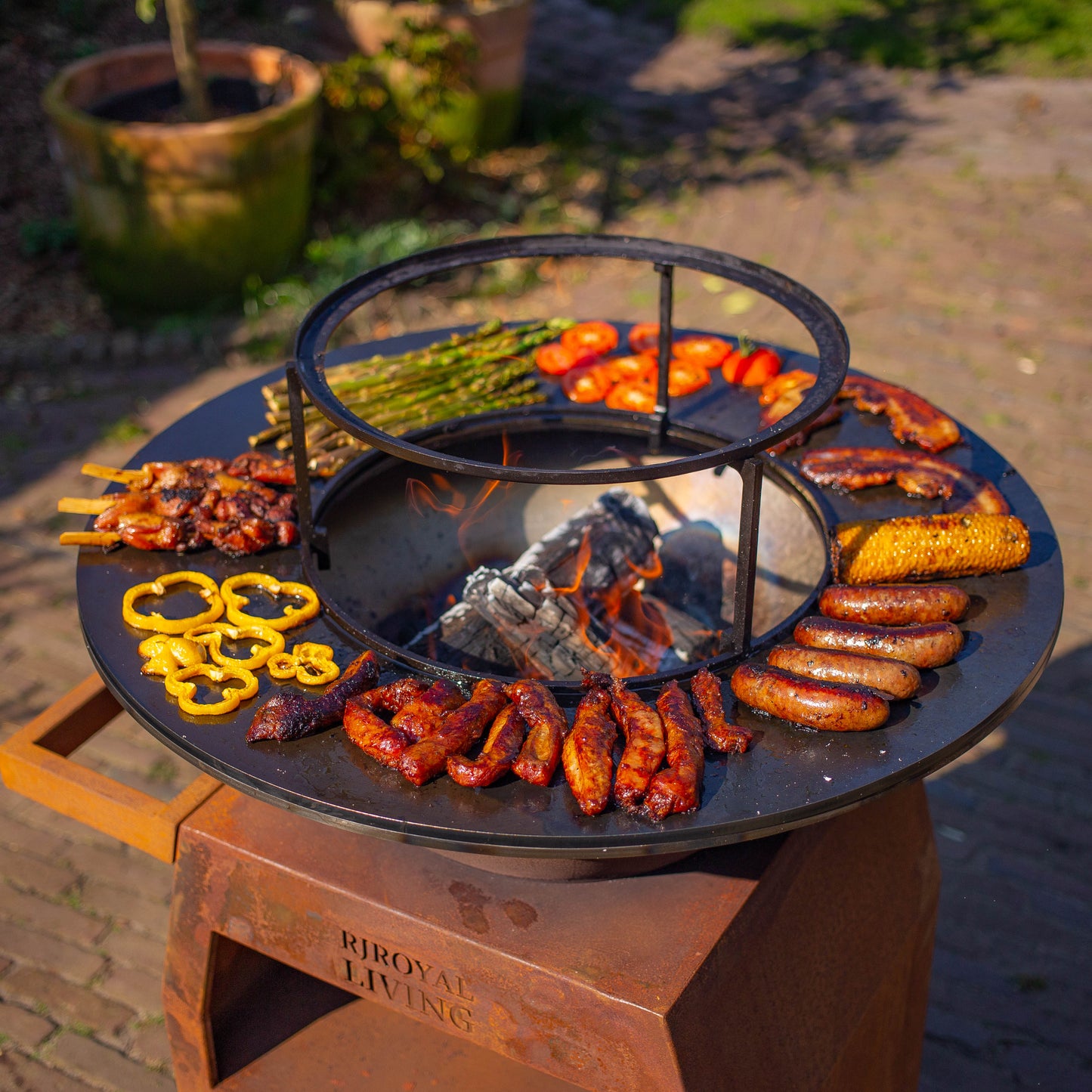 BBQ Plancha Grill Maestro XXXL Ø70cm Acciaio Corten - Con ruote grandi e contenitore per la legna